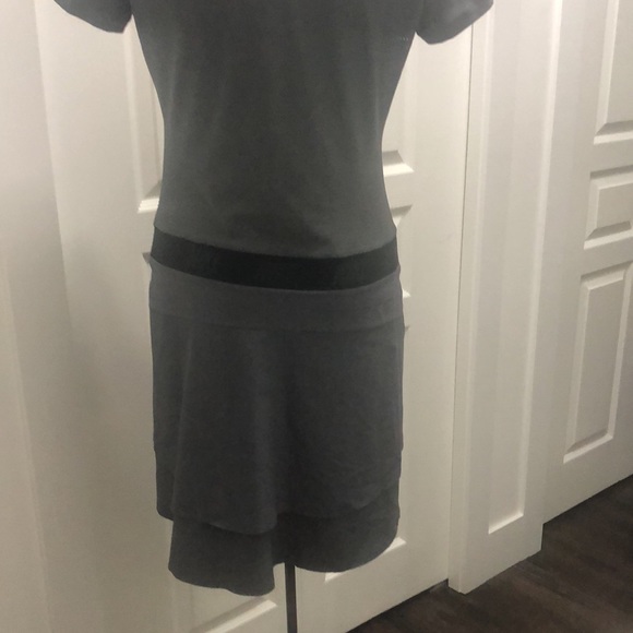 This gray Nike golf dress has flowing skirt in the back. - Picture 3 of 3
